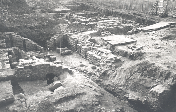 photo of ruined stone foundations being excavated.